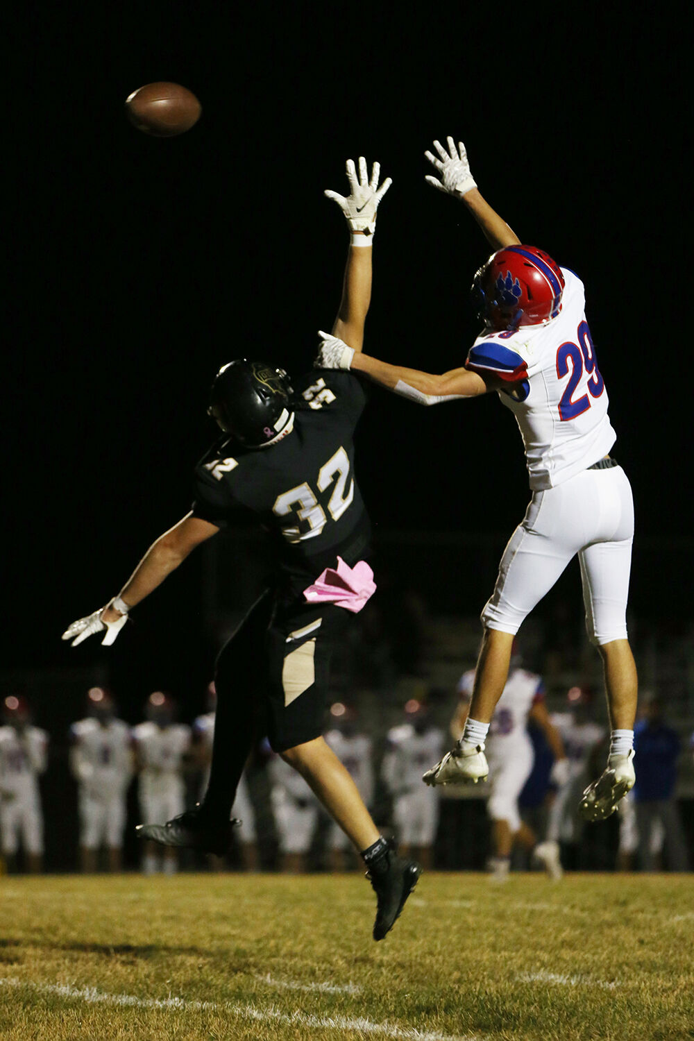 Calvin Rule leaps for an attempted pass while being defended